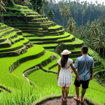 ** A couple holding hands, overlooking the Tegalalang Rice Terraces in Ubud. The rice paddies should be lush green, and the couple should be dressed in comfortable but stylish vacation attire. Emphasize the natural beauty of Bali.

**